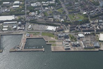 Oblique aerial view of East India Harbour and Custom House Place, looking SW.