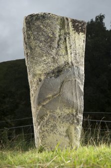 View of upright slab with incised cross at top of stone