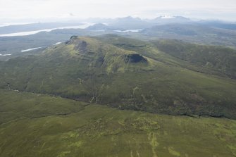 Oblique aerial view of Ben Dearg with Portree and the Cullins beyond.
