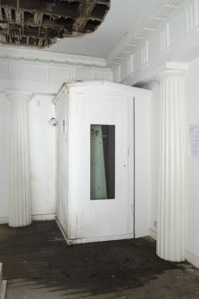 Ground floor. Central room. View of fitted cupboard in south west corner.