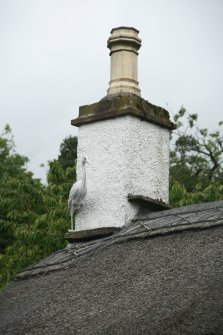 Detail of thatching and ridge around chimney base; 1 and 3 Main Street, Glamis.