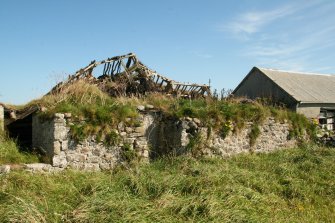 View of ruined former traditional 19th century single storey cottage, roof and thatching mostly collapsed, Tiree, Balevullin.