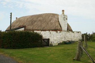 View of 19th century traditional cottage thatched in marram, Barrapol,Tiree.