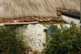Detail of  thatched roof showing brick weights, 19th century  cottage,. Barrapol, Tiree.