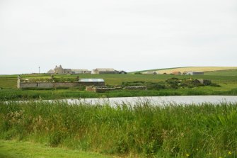 Distant view of long crofting range, West Aith, possibly part thatched; West Aith, Orkney.