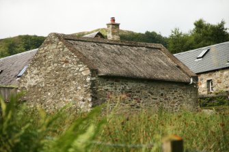 Rear view of bothy to show thatched roof and concrete ridge; Nether Tullicro, Dull.