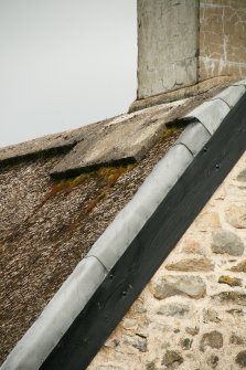 Detail of chimney stack, ridge and thatched roof with lead flashing; East Cottage Nether Tullicro, Dull.