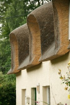 Detail of thatching above dormer windows; Kirkton Cottage, Fortingall.