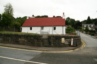 View of single storey  formerly thatched cottage with corrugated iron roof; Atholl Road, Pitlochry.