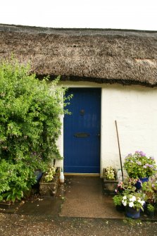 Detail of thatching over doorway; West End Cottages, Rait.