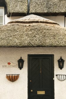 Detail of thatching over doorway; Rose Cottage, Town Yetholm.