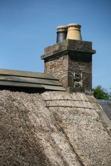 Detail of roof, chimney stack and cedar wood ridge; Soutar Johnnie's cottage, Kirkoswald.