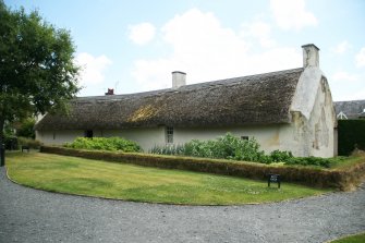Rear view of cottage showing thatched roof and ridge;  Robert Burns Cottage, Alloway.
