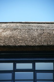 Detail of netted thatch above window; Newlands Place, East Kilbride.