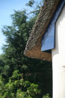 View of roof corner showing boarding and thatch overhang;Newlands Place, East Kilbride.