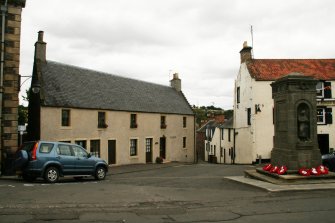 View of two 2 storey 18th century houses with slated roofs possibly previously thatched ; Brae House, 25-27 High Street, Auchtermuchty.