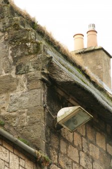 Detail of crowstepped skews and thatch over cement fillet;  Moncrief House, High Street, Falkland.