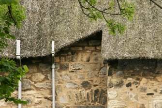 View of rear elevation showing angular thatching around eaves;  Moncrief House, High Street, Falkland.