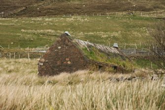 Side view of cottage showing poor state of roofing; Melvaig.