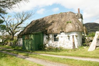 General view of thatched, cruck framed cottage; 12, Lower Ardelve.