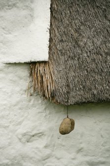 Detail of thatch with stone weight;  2 Luib, Skye.