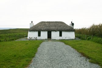 View of modernised, thatched cottage; Totscore, Skye.