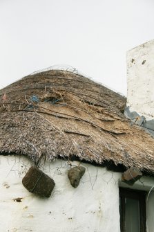 Detail of roofing beside chimney showing general deterioration;Totscore, Skye.