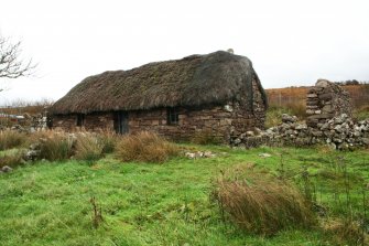 View of 19th century single storey thatched cottage; Applecross.