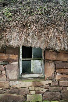 Detail of damaged thatch over window frame, Boat House, Applecross.