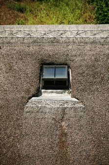 Detail of attic window showing scobed thatch; 30 High Street, Avoch.