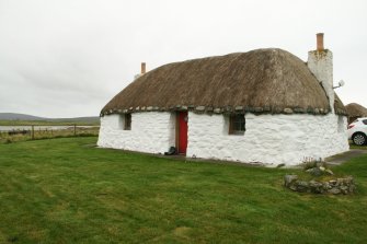 View of early 20th century marram thatched cottage; Tigh na Boireach, Reumisgarry, North Uist.