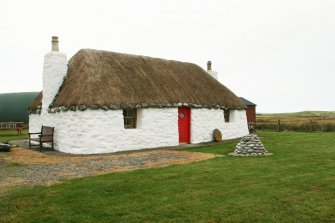 View of 20th century marram thatched cottage; Tigh na Boireach, Reumisgarry.