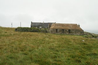 View of probable 19th century marram thatched cottage; Laimrig Ruadh, Berneray.