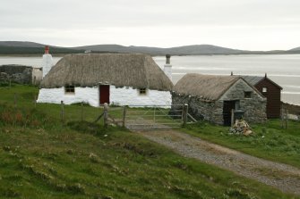 View of probable 18th century thatched cottage and outbuildings; Struan Ruadh, Malaclete.