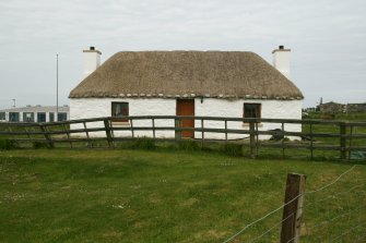 View of renovated, marram thatched cottage; Balivanich, Benbecula.