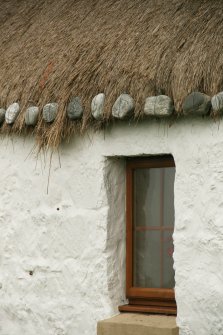 Detail of thatched roof with stone weights;  thatched cottage, Balivanich, Benbecula.
