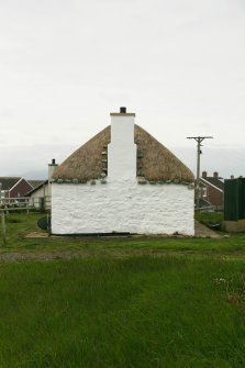 View of gable end and chimney stack; thatched cottage, Balivanich, Benbecula.