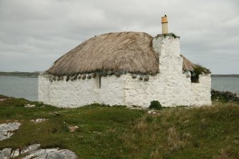 View of weighted thatched roof; 11 Rhugha Sinish, South Uist.
