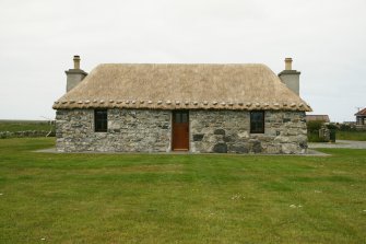 View of renovated probable 19th century marram thatched cottage;  Eochar, 96 Bualadubh, South Uist.