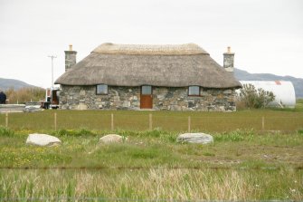 View of new build reed thatched cottage; Cille Pheadair, South Uist.