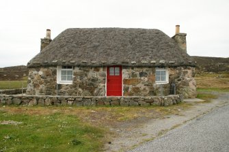 View of renovated 19th century single storey thatched cottage;466 South Lochboisdale, South Uist.
