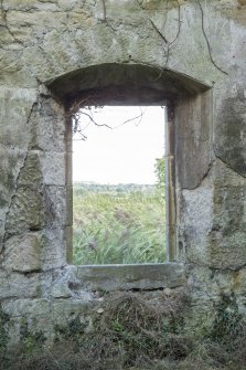 Distillery building, south range, grain miling area. Detail of arched window in east wall