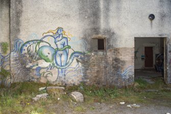 Laundry block. View of graffiti art from west.