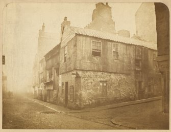 View of houses at corner of Horse Wynd and Cowgate, Edinburgh, looking east, prior to demolition.
