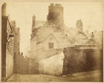 View of house at south east corner of College Wynd, Cowgate, Edinburgh, prior to demolition.
