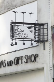 Detail of sign at west end of shop front