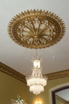 Ground floor. Dining room. Detail of ceiling rose and chandelier.