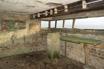 Battery Observation Post, ground floor room, view showing rangefinder plinth and bench.