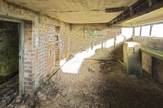Battery Observation Post, ground floor room, view showing rangefinder plinth and remains of furnishings.