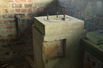 Battery Observation Post, ground floor room, detail of mounting bolts on top of rangefinder plinth.